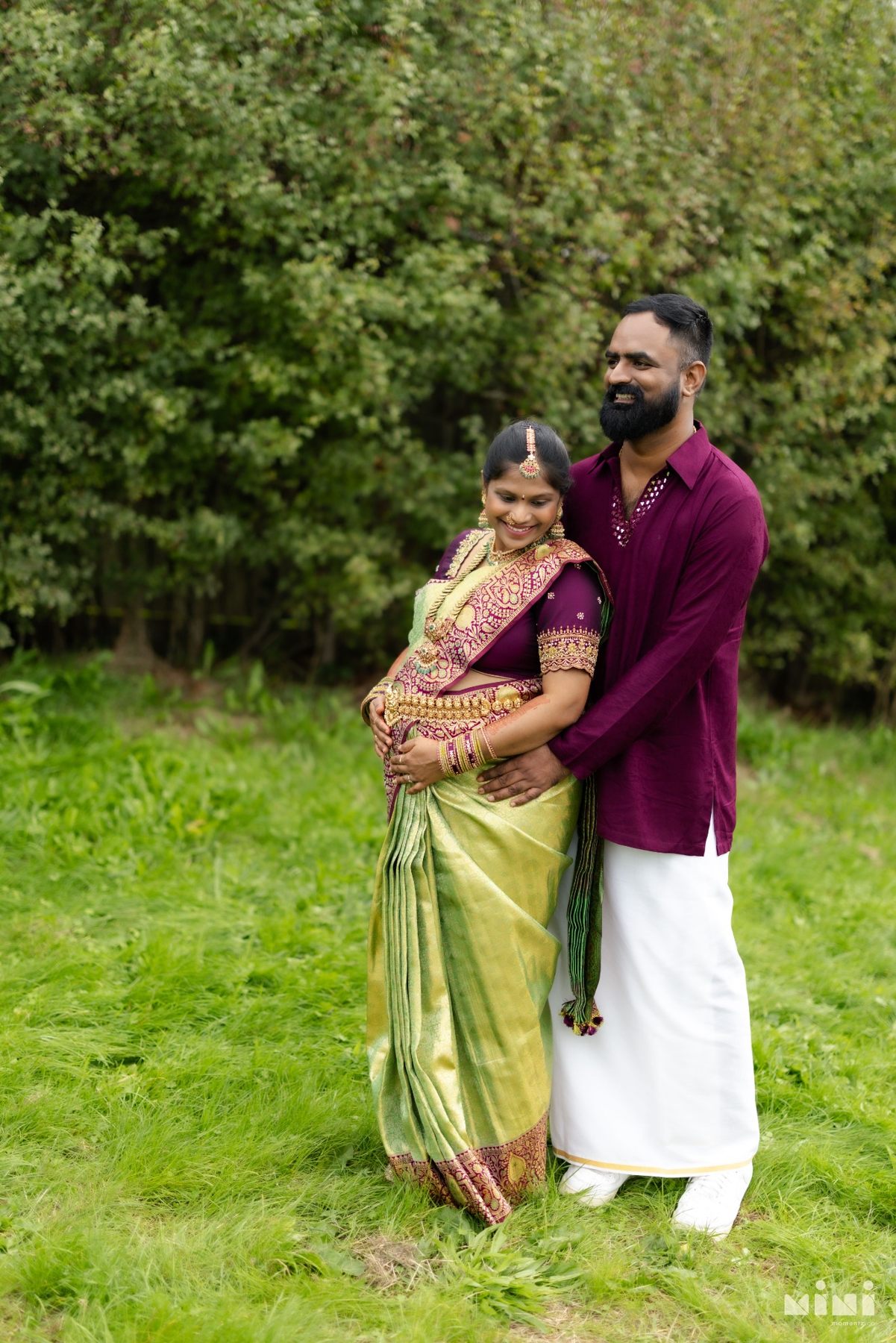 Divya and Ravi together in a quiet outdoor maternity portrait