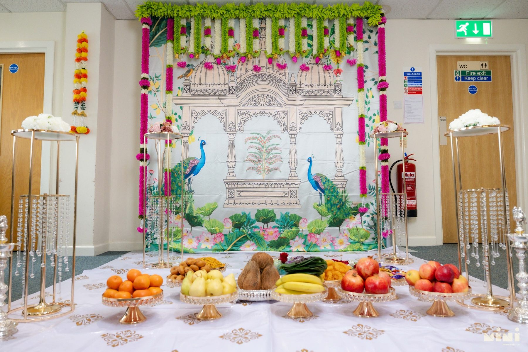 Traditional Seemantham stage in Bridgend decorated with flowers and fruit offerings