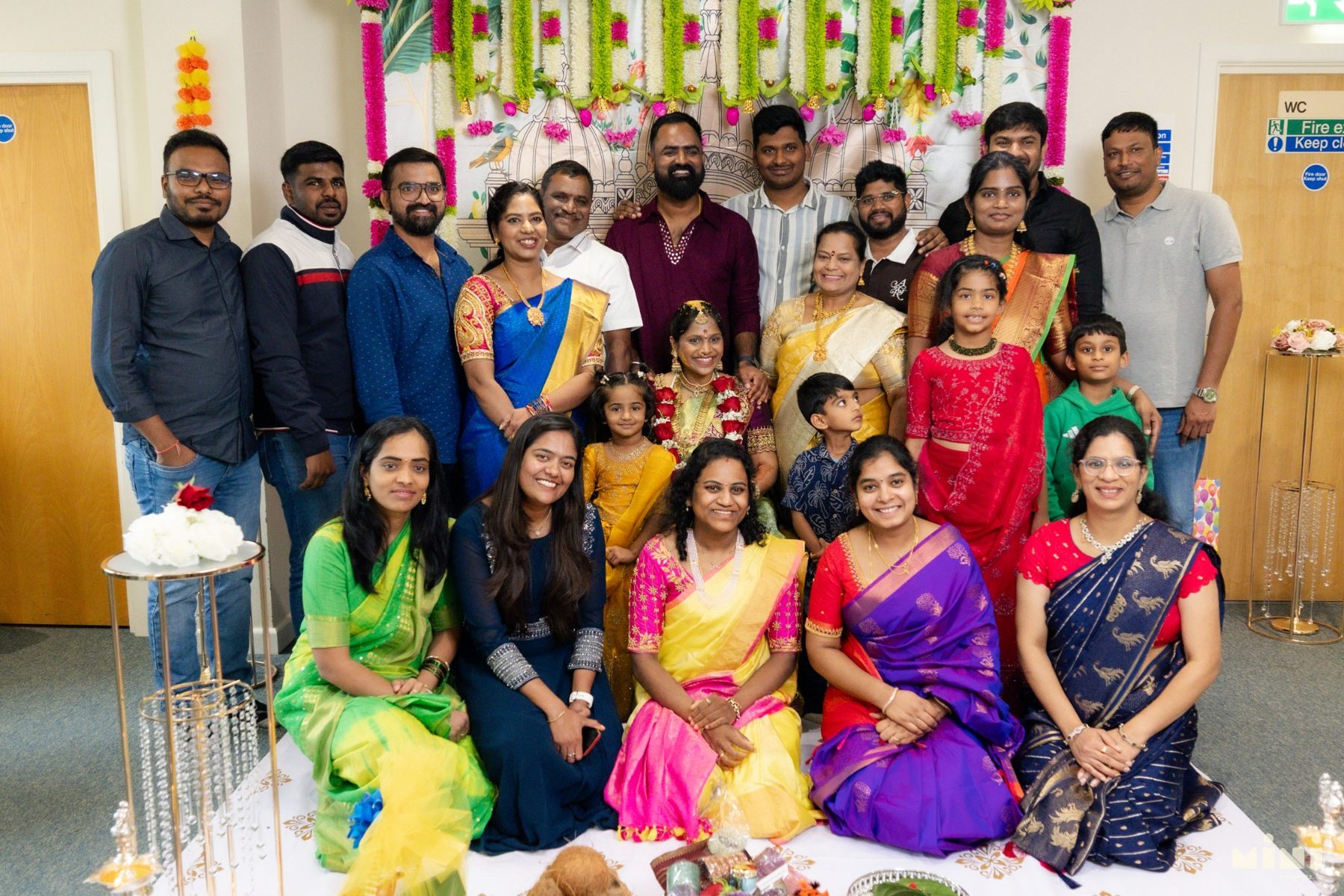 Large family group gathered to celebrate Divya and Ravi’s traditional baby shower